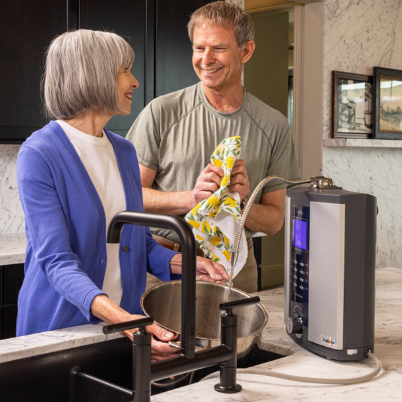Older male and female in kitchen with Alkaviva Athena H2 Hydrogen water ionizer 